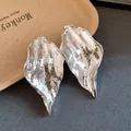 Macro detail of silver crumpled leaf earrings showing unique metallic texture - Wrinkled Leaf Studs / Silver