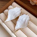 Elegant white pleated leaf earrings with gold-plated wavy edges in a jewelry box - Wrinkled Leaf Studs / White