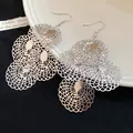 Detail view of silver layered lace hollow circular dangle earrings with fishhook - Silver