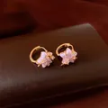 Detailed close-up of pink star-shaped hoop earrings with sparkling zircon accents. - Five-Pointed Star Hoop Earring (HE33856) / Gold-Pink