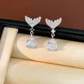 Detailed shot of sparkling fishtail drop earrings with pear-shaped zirconia stones. - Fish Tail Water Drop Style (HE34041) / Silver