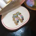 Elegant silver-plated hoop earrings featuring colorful irregular glass stones for a vibrant look. - Silver / Colorful