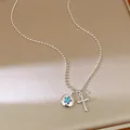 Detailed view of silver bead chain necklace featuring a star disc and cross charm - Star Round Tag Cross Pendant / Silver-Blue