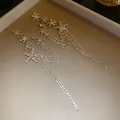 Detailed view of elegant silver needle star flower tassel dangle earrings for women - Silver Post Long Tassel Earrings / Gold