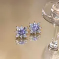 Detailed macro shot of sparkling purple flower ear clips with brilliant cubic zirconia - Flower Ear Cuff (Pair) / Purple/Silver
