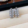 Close-up detail of vintage French style stud earrings with silver needles, zircons and pearls - 925 Silver Post Style / Silver (White Pearl)