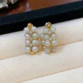 Detailed macro view of elegant French vintage gold pearl earrings with zircon accents - 925 Silver Post Style / Gold (White Pearl)