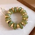 Bracelet vintage élégant avec perles marbrées vertes et accents dorés de luxe - Vert