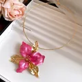 Close-up of vintage pink enamel flower collar necklace with elegant gold plating - Necklace / Rose Red
