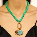 Chic ocean themed beaded necklace featuring turquoise beads, gold clasp, shell and crab charms. - Style 01 (9522) / Green