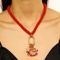 Vibrant red beaded ocean themed necklace featuring golden crab and starfish charms - Style 02 / Red