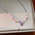 Detail view of a lavender glass beaded necklace with purple zirconia flower pendant - Flower Pendant Clavicle Chain (HN12469) / Blue Purple
