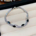Close-up of 18k gold plated bracelet with sparkling zircons and black marquise stones - Black Drop Pendant (3#)