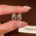 Close-up detail of 18k gold plated honeycomb hoop earrings with sparkling zircon stones - Honeycomb C-Shaped / Silver
