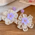 Macro view of handmade purple raffia flower drop earrings with sweet resort style - Flower Style (HE34251) / Purple