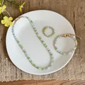 Detailed view of a fresh green glass bead jewelry set with necklace, bracelet and ring. - Necklace Bracelet Ring Set (HN11543) / Blue Green