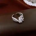 Close-up of a silver-toned open ring featuring a large round zircon and twisted texture - Round Zirconia Twisted Pattern Open Ring / Silver