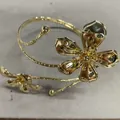 Elegant gold-tone metal arm cuff bracelet with exquisite five-petal flower design - Gold