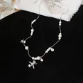 Detailansicht der eleganten silbernen Seestern-Halskette mit Zirkonia und weißen Perlen - Reinweiße Perle Seestern Stil / Silber