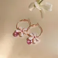 Close-up of elegant rose gold hoop earrings with pink resin flower and crystal drop - French Minimalist Hoop (HE32185) / Rose Gold-Pink