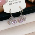 Close-up of heart-shaped cherry earrings with pink resin and clear rhinestones - Cherry Ear Buckle / Pink and Silver