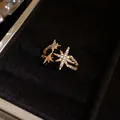 Close-up view of gold star-shaped open ring with sparkling cubic zirconia details - Real Gold Plated / Gold