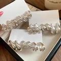 Vintage silver-colored earring set featuring flower and waterdrop designs on cards - Eighteen-Piece / Silver Needle / Silver