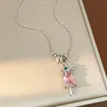 Detailed macro view of a pink zircon ice cream popsicle pendant necklace with snowflake - Silver-Pink
