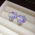 Close-up of elegant flower stud earrings with purple crystals and white pearls in a box - Flower Shape (HE33484) / Lavender