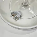 Detailed macro view of a luxury silver multi-layer cubic zirconia ear cuff for women - Silver