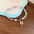 Hand-woven colorful braided rope bracelet with pearls and a cute donut charm pendant - Pink-Donut Style