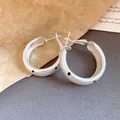 Elegant silver matte hoop earrings featuring a stylish black polka dot pattern - Minimalist Polka Dot Hoop (HE33968)