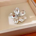 Macro detail of a sparkling five-petal crystal flower open ring in a premium gift box - Rhinestone Flower Open Ring (HR3603) / Silver-White