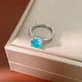 Exquisite close-up of an adjustable silver ring featuring a vibrant square-cut blue zircon. - Lake Blue Square Open Ring