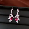 Macro detail of silver leaf earrings with vibrant teardrop-shaped pink stones - Silver Post-Silver-Rose Red