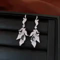 Detailed view of elegant silver leaf earrings featuring sparkling water-drop zircon stones - Silver Post-Silver-Clear