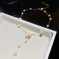 Elegant 18K gold-plated butterfly necklace with white pearls and zircon accents jewelry - Gold