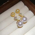Macro detail of 18k gold plated pearl earrings with sparkling zircon flowers - 18K Gold Plated Flower Pearl Stud Earrings / Pink Gold