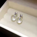 Eleganti orecchini a lobo in argento con zirconi e dettaglio a sfera trasparente - Orecchini a Bottone con Sfera / Argento