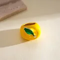 High-quality detailed view of a creative yellow apple-shaped ring with green leaf drip oil detail - Yellow