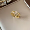 Close-up detail of 18k gold plated ring featuring sparkling star and moon zirconia - Open (HR3087) / Gold