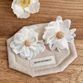 Detailed macro view of off-white ribbon flower earrings featuring woven raffia center details - Flower Style (HE33639) / White-Coffee