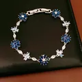 Detail view of a vintage-style zircon flower bracelet featuring elegant blue stones - Patchwork Flower Style / Dark Blue and Light Blue