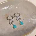 Elegant silver hoop earrings featuring a zircon crescent moon and a blue teardrop pendant. - Moon Waterdrop Style (HE33622) / Silver-Blue
