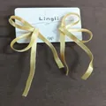 Elegant light gold ribbon bow earrings with anti-gravity long tassels for women fashion - Silver Needle / Yellow