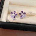 Close-up detail of purple zircon flower ear bone clips with elegant center pearl inlay - Pearl Tassel Flower Ear Cuff / Silver-Purple