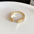 Elegant gold-tone metal open cuff bracelet with waterdrop ends for women, retro style - Minimalist Open Cuff / Gold