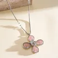 Detailed view of a pink resin flower necklace with silver chain and textured petals. - Necklace / Pink
