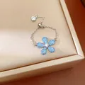 Bague chaîne réglable élégante ornée d'un pendentif en forme de fleur en cristal bleu - Aqua