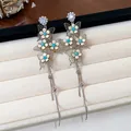 Detailed view of elegant silver butterfly and flower tassel earrings with rhinestones - Butterfly Flower Tassel Style / Silver-Blue